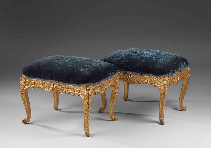 A pair of carved and giltwood Régence tabourets
